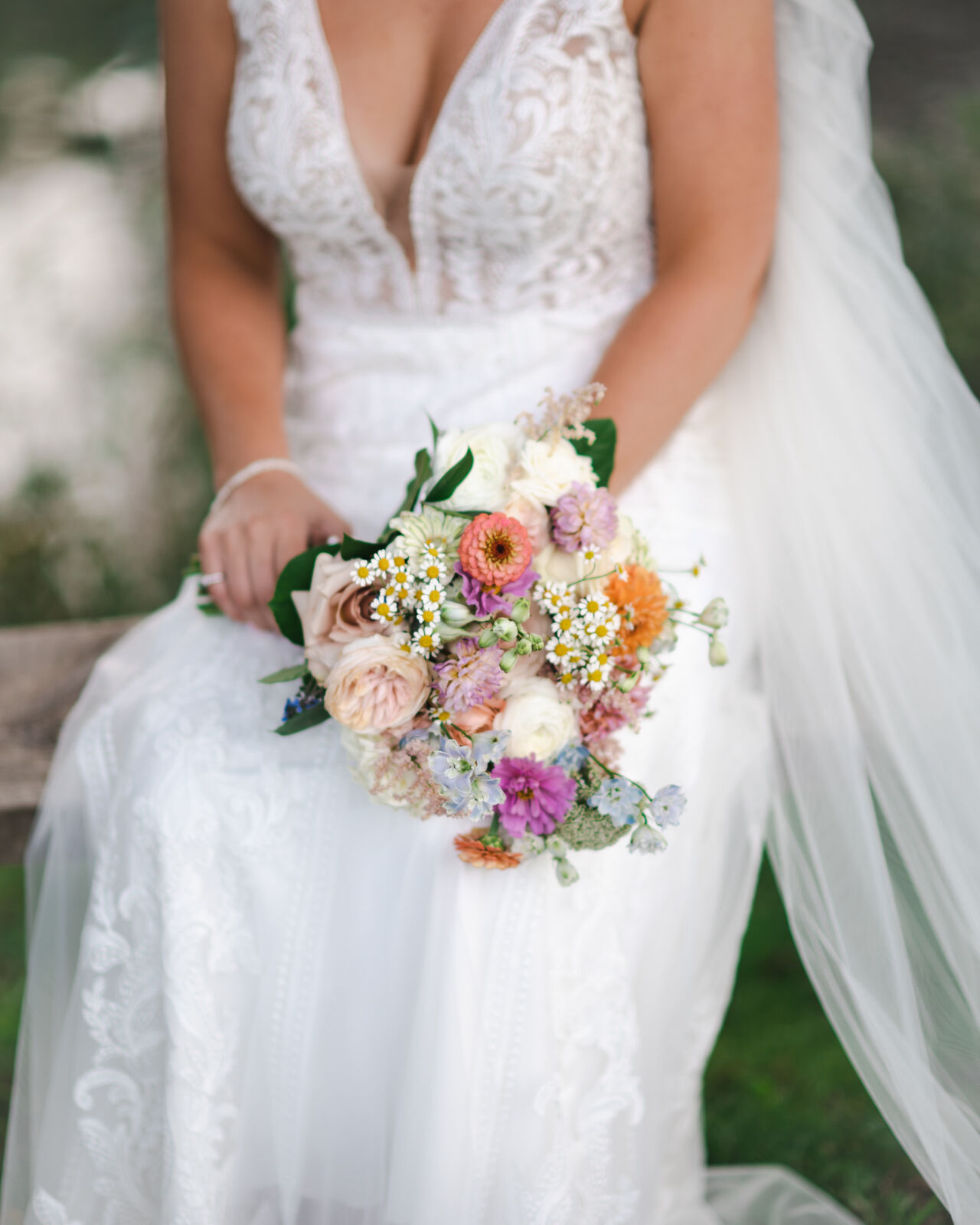 Bride holding a colorful garden bouquet