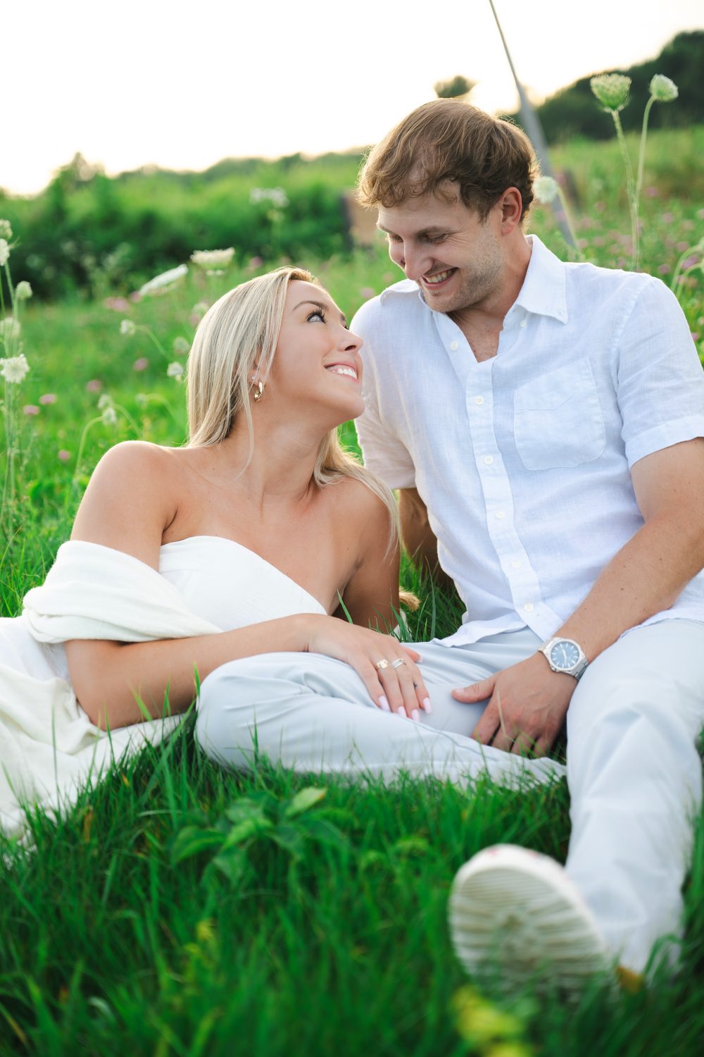 A couple sharing a quiet morning together in a New England summer meadow